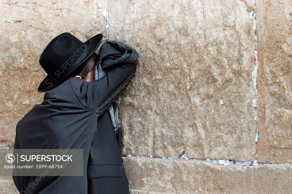 Orthodox Jew praying at the Kotel, also called Western Wall or wailing wall