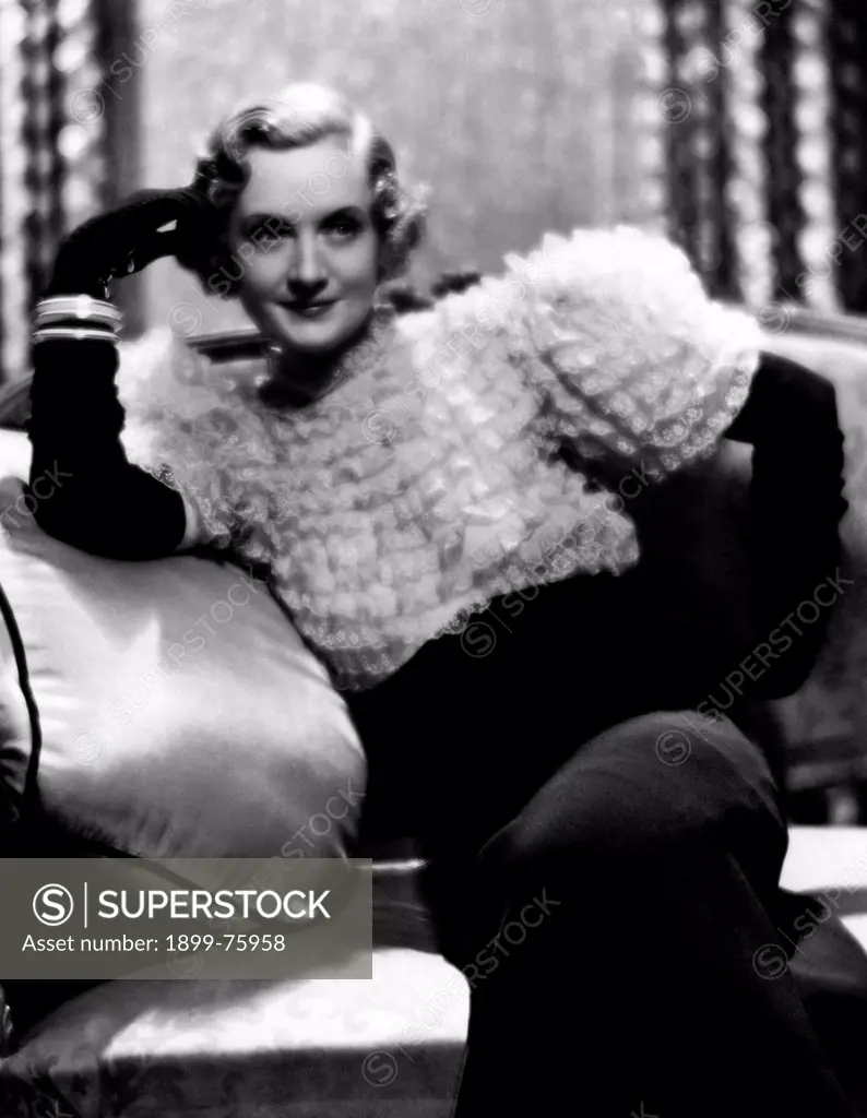 American actress Billie Burke (Mary William Ethelbert Appleton Burke) sitting on a coach in the film Only Yesterday. 1933. Only Yesterday, 1933, directed by John M. Stahl, USA, drama, with Billie Burke