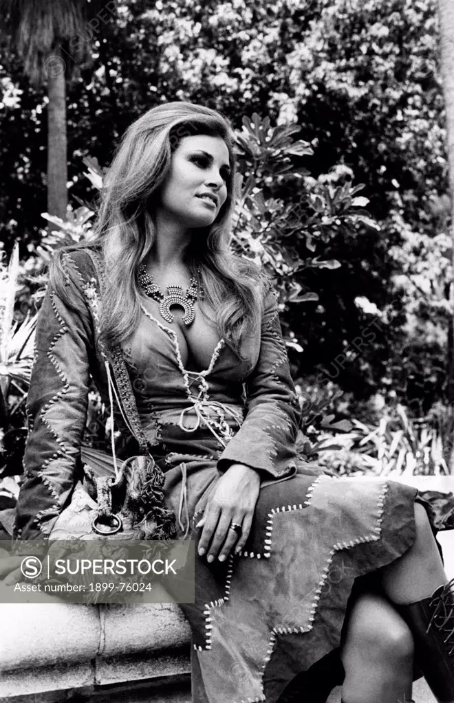 Portrait of American actress Raquel Welch (Jo Raquel Tejada) in a garden. Rome, 1970s.