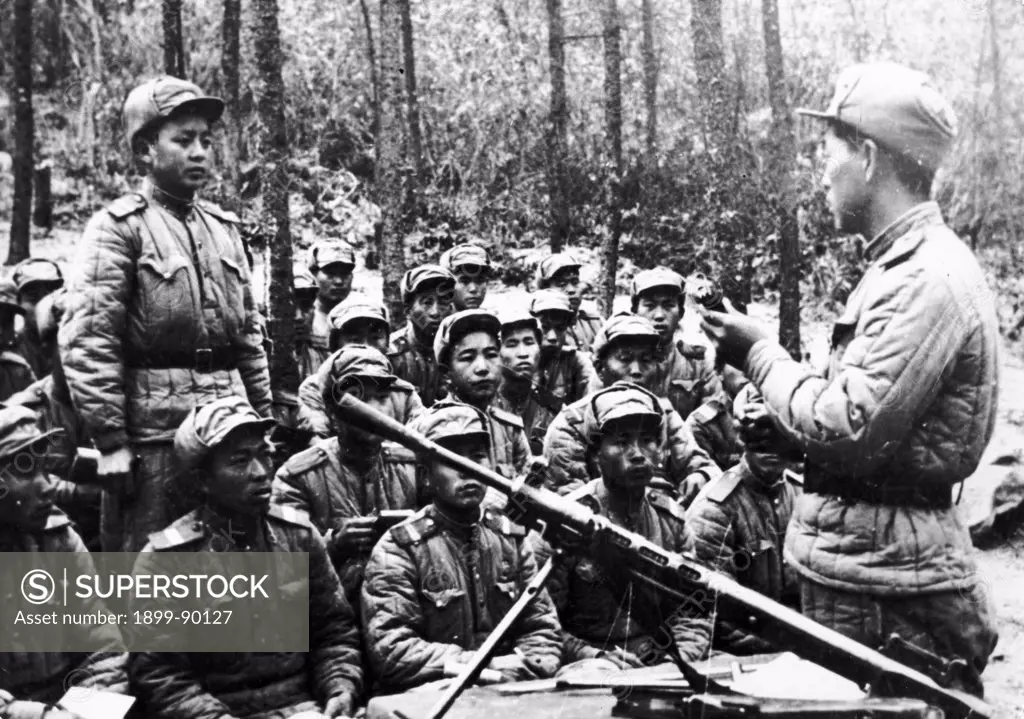 Korean War. A group of soldiers of the North Korean People's Army taking in a lesson on the battlefield. 1953.