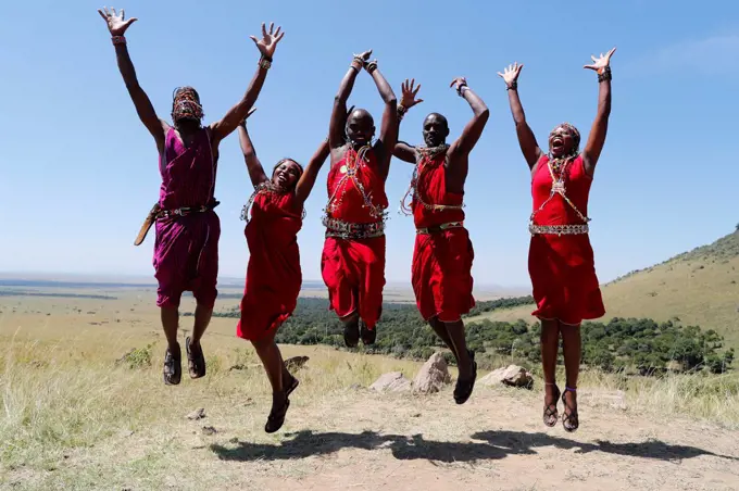 Masai warriors doing the traditional jump dance. Masai Mara National Park. Kenya.