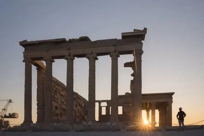 Tourist man sightseeing at the Acropolis at sunset on summer vacation, Athens, Attica Region, Greece, UNESCO World Heritage Site, Europe