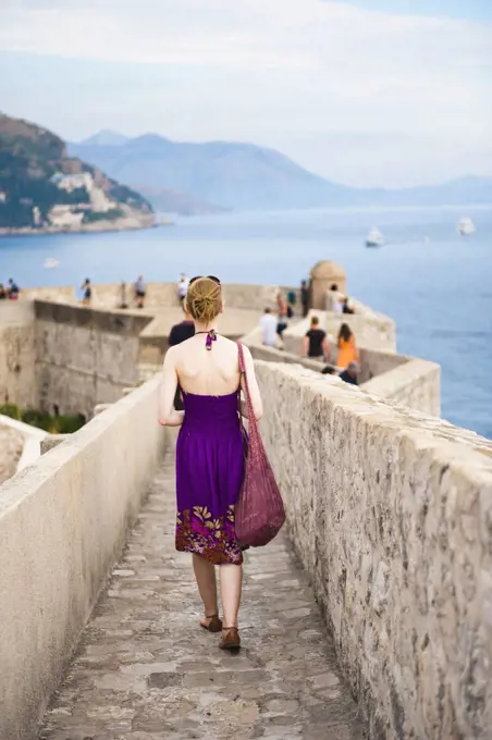 Photo of a tourist on Dubrovnik City Walls, Dubrovnik Old Town, Croatia