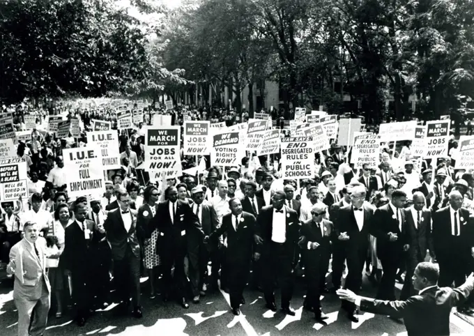 Rev. Dr. Martin Luther King, Jr. and others link arms at March on Washington, 8/28/63. (GG Vintage Images/UIG)