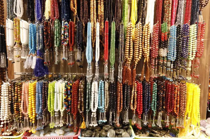 Muslim prayer beads ( tesbih ) in different patterns and colors.  Dubai. United Arab Emirates.