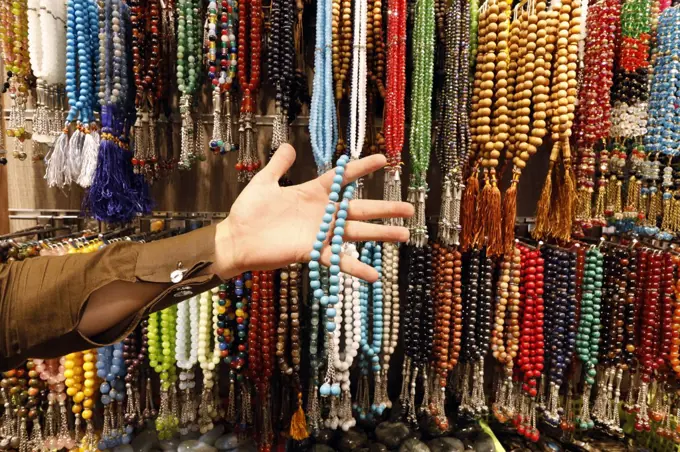 Muslim prayer beads ( tesbih ) in different patterns and colors.  Dubai. United Arab Emirates.