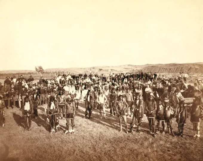 At the Dance. Part of the 8th U.S. Cavalry and 3rd Infantry at the great Indian Grass Dance on Reservation 1890.