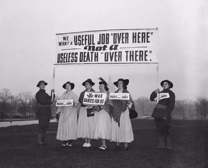 Anti-war protesters against World War II holding signs circa 1940 .