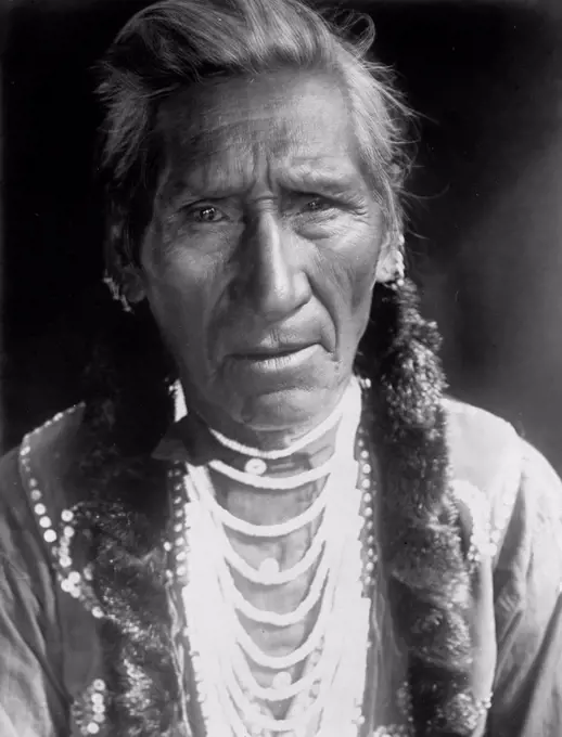 Edward S. Curits Native American Indians - Photograph shows Flathead man, head-and-shoulders portrait, facing front circa 1910.