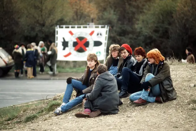 Anti-nuclear demonstrators sit outside the air base during the arrival of Ground Launch Cruise Missile equipment..