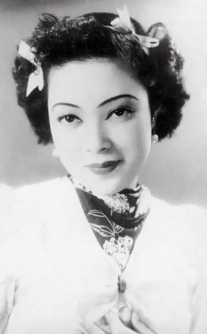 Yoshiko made her debut as an actress and singer in the 1938 film Honeymoon Express. She was billed as Li Xianglan, pronounced Ri Koran in Japanese. The adoption of a Chinese stage name was prompted by the Film company's economic and political motivesa Manchurian girl who had command over both the Japanese and Chinese languages was sought after. From this she rose to be a star and Japan-Manchuria Goodwill Ambassadress. Though in her subsequent films she was almost exclusively billed as Li Xianglan; she indeed appeared in a few as 'Yamaguchi Yoshiko.' Many of her films bore some degree of promotion of the Japanese national policy (in particular pertaining to the Greater East Asia Co-prosperity Sphere ideology). At the end of World War II, she was arrested by Chinese government for treason and collaboration with the Japanese. However, she was cleared of all charges, and possibly the death penalty, since she was not a Chinese national, and thus the Chinese government could not try her for