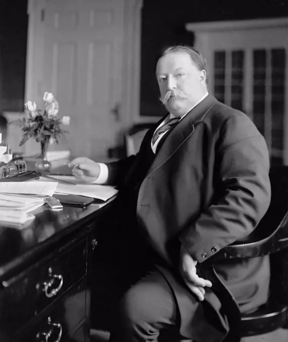 President William Howard Taft sitting at his desk circa 1909-1913.