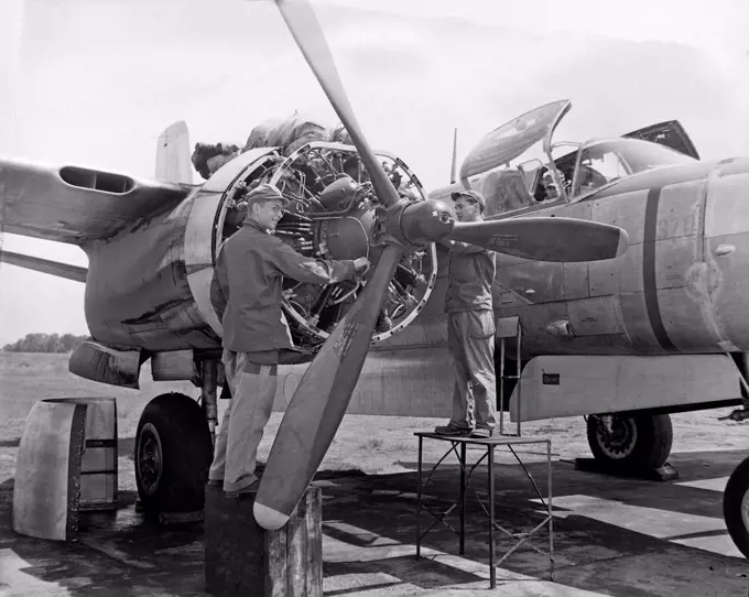 Airman works on a B-26 aircraft at the first North Dakota Air National Guard organizational 'summer camp' at Hector Field, Fargo, N.D., June 1948.