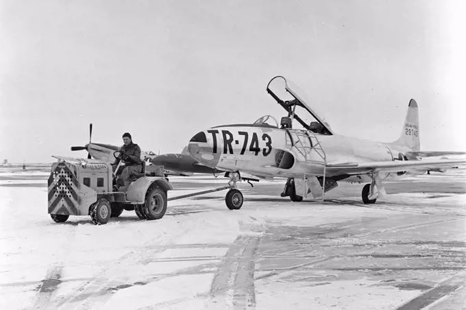 A T-33 aircraft is towed on the flight line at the North Dakota Air National Guard circa 1954.