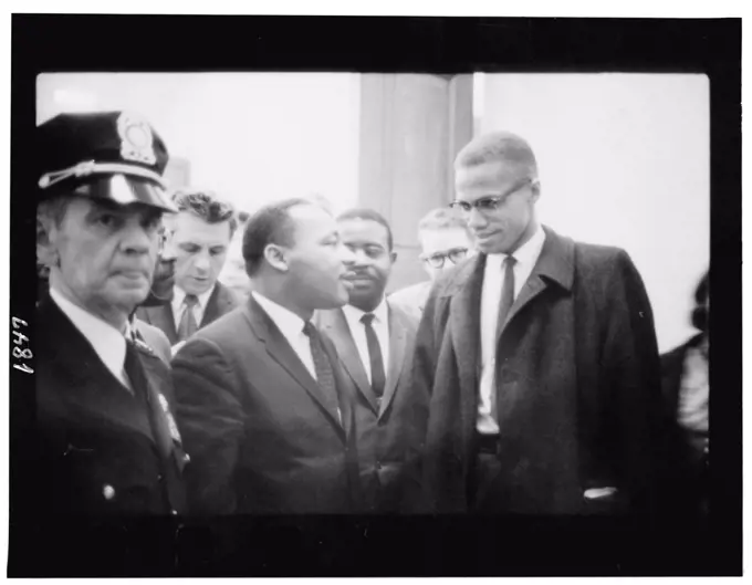 March 26, 1964 - Martin Luther King and Malcolm X waiting for press conference