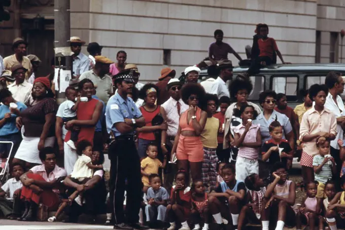 1973 - Members Of Chicago's South Side Black Community Line A Portion Of Dr. Martin L. King Jr. Drive To Watch The Annual Bud Billiken Day Parade, 08/1973. 