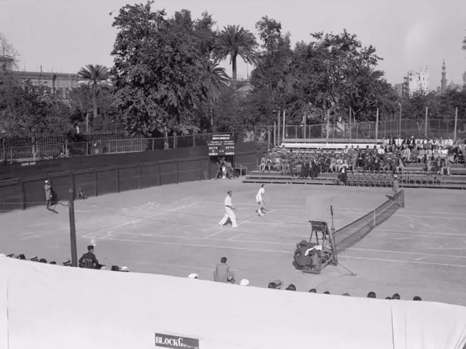 Gezira Gardens & Sports Club in Cairo Egypt, men playing on the tennis courts ca. between 1934 and 1939.