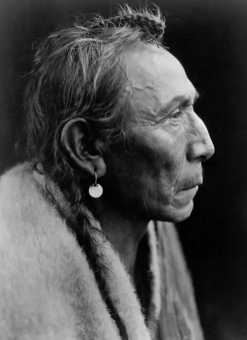 Edward S. Curtis Native American Indians - Aki-tanni, 'Two Guns' - Sarsi - head-and-shoulders portrait ca. 1927. 