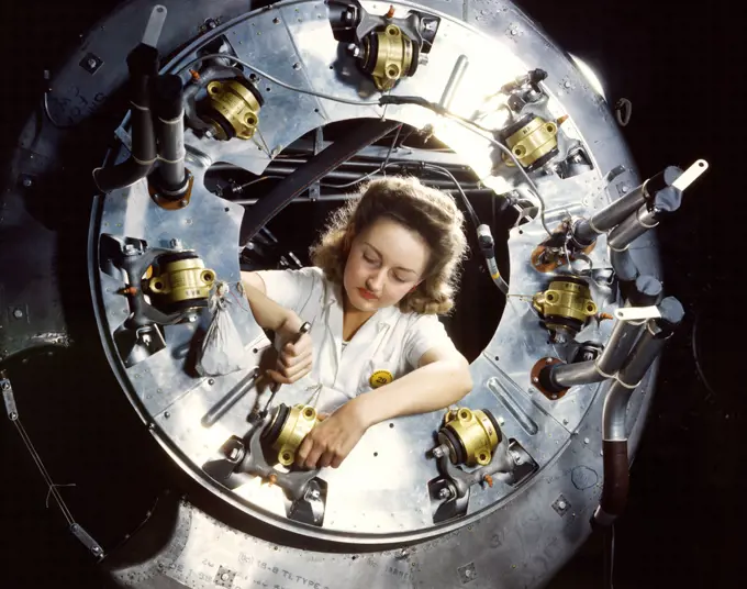 Part of the cowling for one of the motors for a B-25 bomber is assembled in the engine department of North American Aviation, Inc.'s Inglewood, Calif., plant - October 1942. 