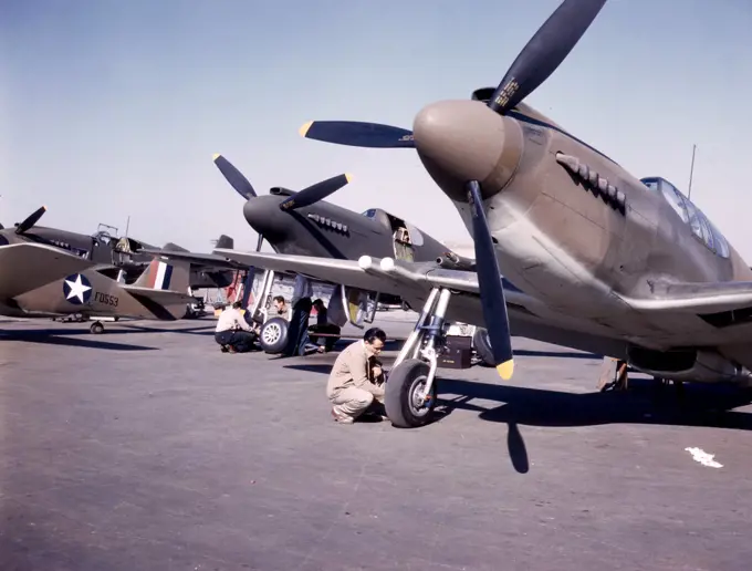 P-51 ('Mustang') fighter planes being prepared for test flight at the field of the North American Aviation, Inc., plant in Inglewood, Calif. - October 1942. 