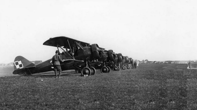 PWS-26 aircraft in CWOL. Commander of the Aviation Officers Training Center in Dblin Lt. Col. Stefan Sznuk (in the distance) releases the first PWS 26 aircraft ca. May 1937. 