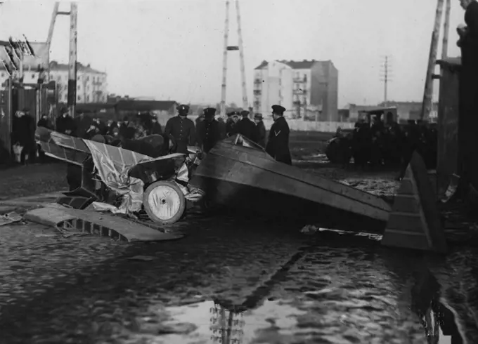 Soldiers or police looking over remains of an airplane crash in Poland ca. 1931. 