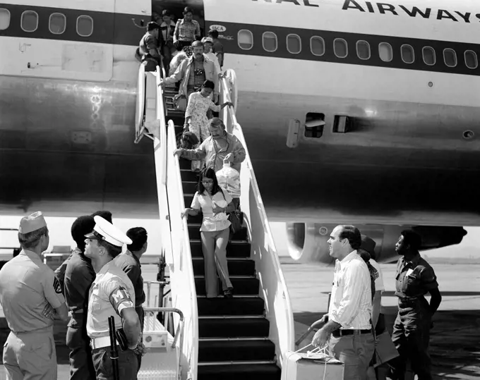 1975 - Vietnamese refugees arrive at the air station after being evacuated from Saigon.  . 