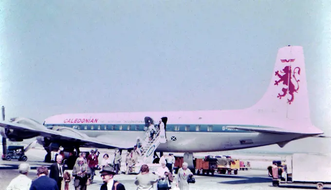 Passengers departing from an airplane at an unidentified airport in Israel . 