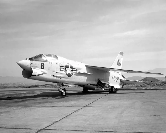 1966 - A left front view of an F-8C Crusader aircraft parked on the flight line.  The aircraft is assigned to Marine Fighter Squadron 334 (VMF-334). 