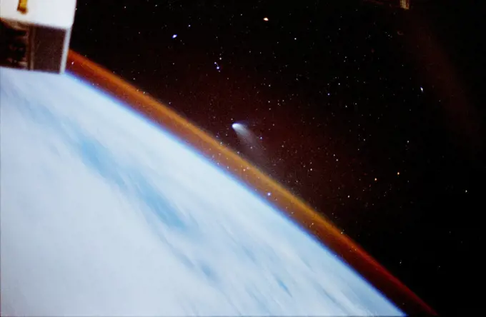 (15-24 May 1997) --- Comet Hale Bopp, seen and photographed a month and a half ago by the STS-83 crew aboard the Space Shuttle Columbia, was also visible on this mission and the crew took advantage of several photo opportunities. A crewmember used an eight-second time exposure on a 35mm camera to expose this frame of the comet over Earth's horizon. Streaking of the stars, usually associated with time exposures, was avoided due to Space Shuttle Atlantis' inertial attitude with the stars.. 