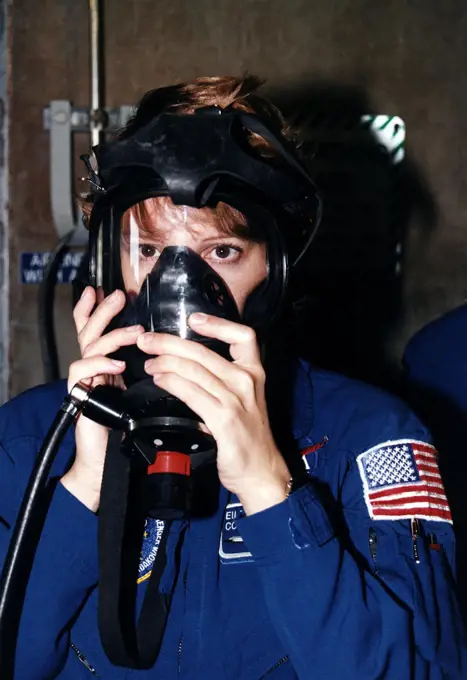 STS-84 Pilot Eileen Marie Collins practices using a gas mask during Terminal Countdown Demonstration Test (TCDT) activities at Launch Pad 39A. STS-84 will be the sixth docking of the Space Shuttle with the Russian Space Station Mir. It will be second space flight for Collins, who was the first woman Shuttle pilot on her initial mission, STS-63 in 1995. After docking, STS-84 Mission Specialist C. Michael Foale will transfer to the space station and become a member of the Mir 23 crew, replacing U.S. astronaut Jerry M. Linenger, who will return to Earth aboard Atlantis. Foale will live and work on Mir until mid-September when his replacement is expected to arrive on the STS-86 mission. STS-84 is targeted for a May 15 liftoff. 