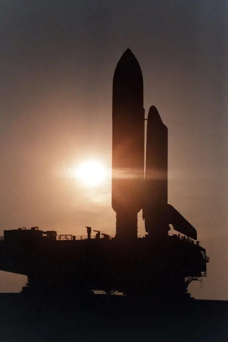 KENNEDY SPACE CENTER, Fla. --  Cast in silhouette by the rising sun, the Space Shuttle Atlantis slowly and carefully makes the journey along the Crawlerway between the Vehicle Assembly Building and Launch Pad 39A. Atlantis and its crew of seven are targeted for a May 15 launch. STS-84 will be the sixth Shuttle docking with the Russian Space Station Mir as part of Phase 1 of the International Space Station program. 