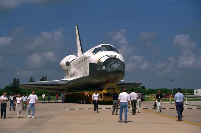 The Space Shuttle Orbiter Discovery rolls over  from Orbiter Processing Facility 2 on top of the orbiter transporter to the Vehicle  Assembly Building for mating with its external tank and solid rocket boosters in  preparation for the STS-85 mission. Several payloads will be aboard Discovery during the  11-day mission, including the Manipulator Flight Demonstration (MFD) and the   Cryogenic Infrared Spectrometers and Telescopes for the Atmosphere-Shuttle Pallet  Satellite-2 (CRISTA-SPAS-2), as well as the Technology Applications and Science-1  (TAS-1) and International Extreme Ultraviolet Hitchhiker (IEH-2) experiments. 