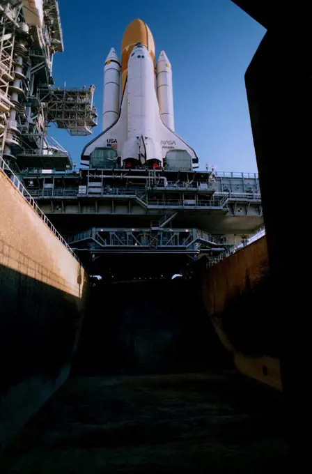 KENNEDY SPACE CENTER, Fla. --  The Space Shuttle Atlantis sits majestically atop its Mobile Launcher Platform and a Crawler-Transporter which straddle the Launch Pad 39A flame trench. This view shows only a portion of the flame trench, which is about 450 feet long, 58 feet wide and 42 feet deep. The Shuttle has just arrived at the launch pad after the journey from the Vehicle Assembly Building. Atlantis and its crew of seven are targeted for a May 15 launch. STS-84 will be the sixth Shuttle docking with the Russian Space Station Mir as part of Phase 1 of the International Space Station program. 