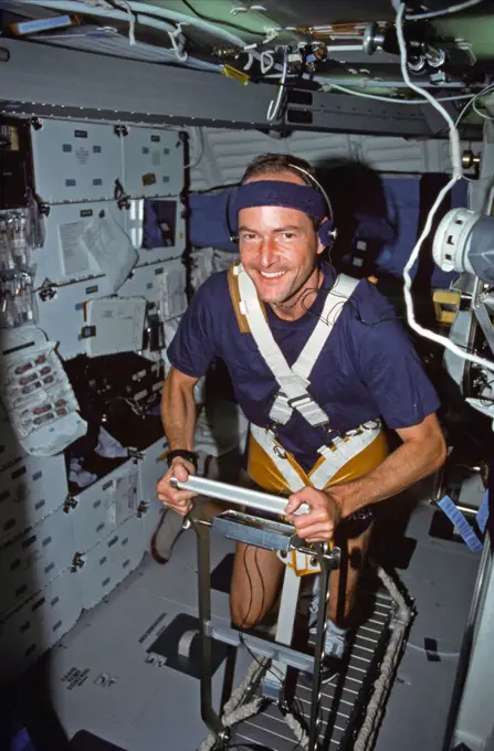  (2-11 Aug 1991) --- Astronaut G. David Low, STS-43 mission specialist, works out on a treadmill device which was used for medical testing on the nine-day flight.. 