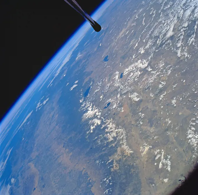 Visible in the view to the west of the Sierra Nevada are the San Joaquin and Sacramento Valleys of central California. The San Francisco/Oakland Bay Area can be seen to the west of the valley at the extreme left of the photograph. To the east or right of the Sierra Nevada, the basin and Range Region of central and northern Nevada is visible. Mono Lake, Lake Tahoe and Pyramid Lake are also visible in this scene. The long northwest/southeast trending Walker Lane Shear Zone, which lies just to the east (right) of the Sierra Nevada is also visible. Near the top of the view (near the horizon), the snow covered volcanic peak Mount Shasta can be seen. Over 645 kilometers (400 miles) long and from 65 to 130 kilometers (40 to 80 miles) wide, the Sierra Nevada have many peaks in excess of 3,300 meters (11,000 feet) above sea level.. 