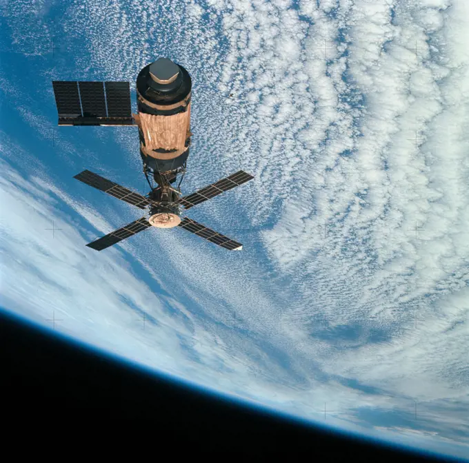  (8 Feb. 1974) --- An overhead view of the Skylab space station cluster in Earth orbit as photographed from the Skylab 4 Command and Service Modules (CSM) during the final fly-around by the CSM before returning home.. 