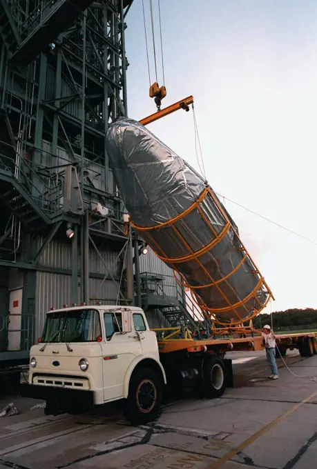 KENNEDY SPACE CENTER, FLA. -- Arriving in the early morning hours at Pad 17A, Cape Canaveral Air Station, the fairing for Deep Space 1 is lifted from the truck before being raised to its place on the Boeing Delta 7326 rocket that will launch on Oct. 15, 1998. . 