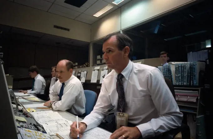 (28 April 1991)--- Two spacecraft communicators at the CAPCOM console monitor the ascent of the Space Shuttle Discovery.  They are astronauts Kenneth D. Bowersox (left) and Brian Duffy.  Launch occurred at 6:33 a.m. (CDT), April 28, 1991.  The scene is in the second floor Flight Control Room (FCR) of the Johnson Space Center's Mission Control Center (MCC).. 