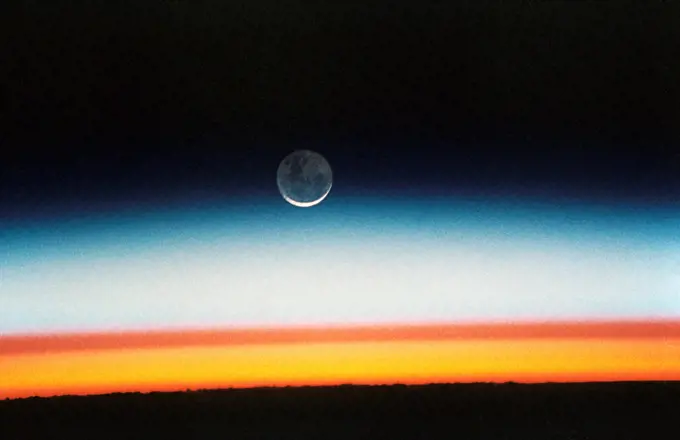 (22 Oct.-1 Nov. 1992) --- As the Space Shuttle Columbia orbited Earth in an easterly direction over the Indian Ocean, moonrise was followed quickly by sunrise.. 