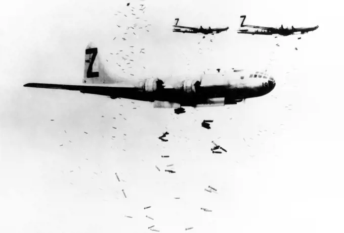 USA/Japan: A flight of USAAF B-29 bombers release incendiary bombs on Yokohama in May 1945