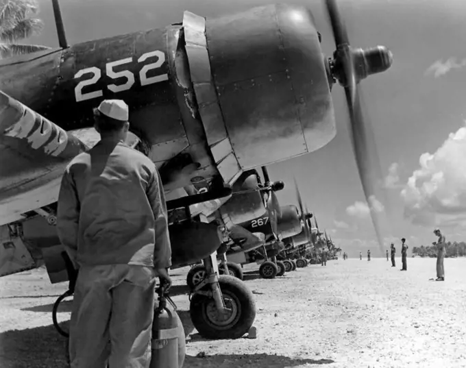 USA/Solomon Islands: U.S. Marines of the 4th Marine Aircraft Wing prepare for sorties in their Vought F4U Corsairs on Guadalcanal, 19 September 1944