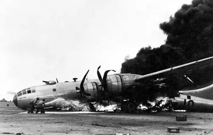 Japan/USA: A Boeing B-29 in flames after an emergency landing at Iwo Jima, Battle of Iwo Jima, March 1945