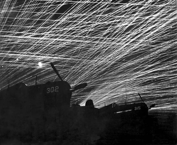 Japan/USA: Japanese night raiders are greeted with a barrage of anti-aircraft fire by the Marine defenders at Yontan airfield. Battle of Okinawa, May 1945