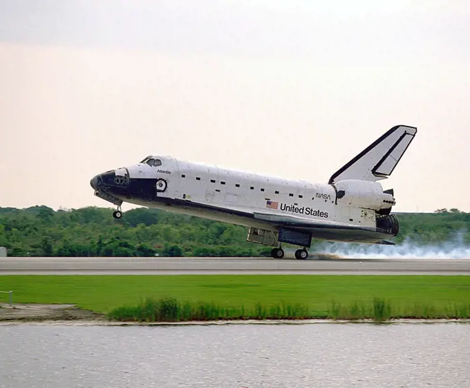 The Space Shuttle orbiter Atlantis touches down on Runway 33 of the KSC Shuttle Landing Facility, bringing to an end the nine-day STS-84 mission. Main gear touchdown was at 9:27:44 EDT on May 24, 1997.