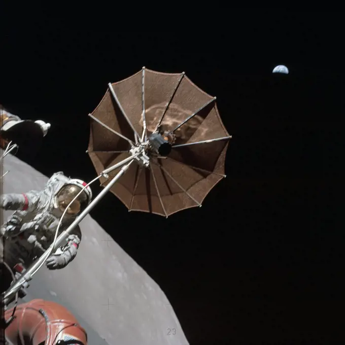 (13 Dec. 1972) --- Earth appears in the far distant background above the hi-gain antenna of the Lunar Roving Vehicle in this photograph taken by scientist-astronaut Harrison H. Schmitt during the third Apollo 17 extravehicular activity (EVA) at the Taurus-Littrow landing site.