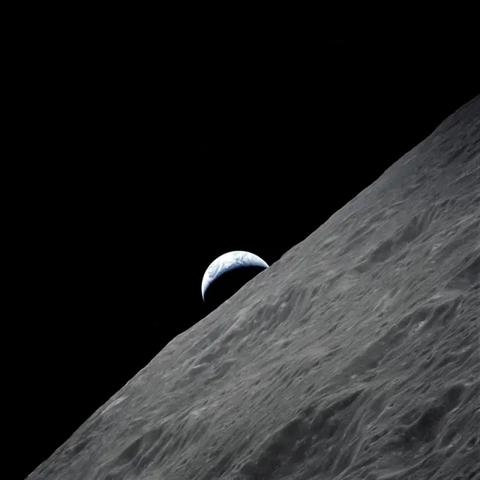 (7-19 Dec. 1972) --- The crescent Earth rises above the lunar horizon in this spectacular photograph taken from the Apollo 17 spacecraft in lunar orbit during the final lunar landing mission in the Apollo program.
