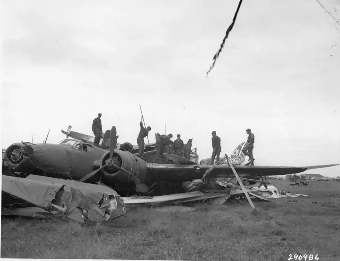 United States military personnel of the occupying forces are shown puncturing the wing tanks of Japanese warplanes to prevent explosions when they were burned at Kumagaya Airfield. The entire Japanese airfleet was scrapped, Honshu, Japan, 10/1945. (US Army/Signal Corps/GG Vintage Images/UIG)