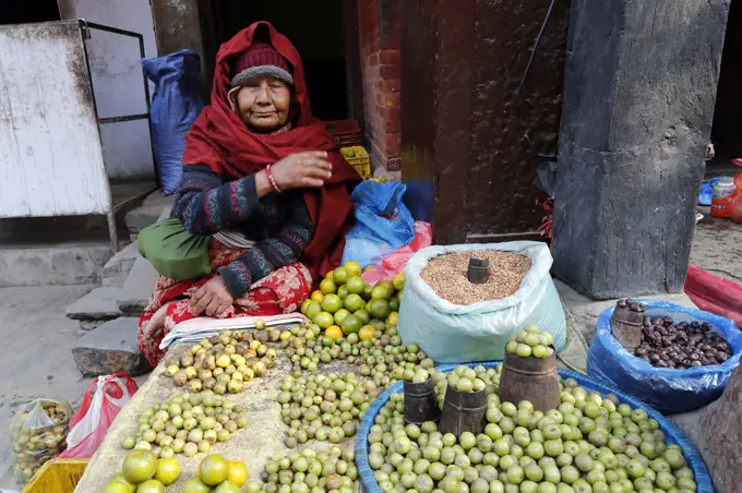 Woman selling lemons in the street..