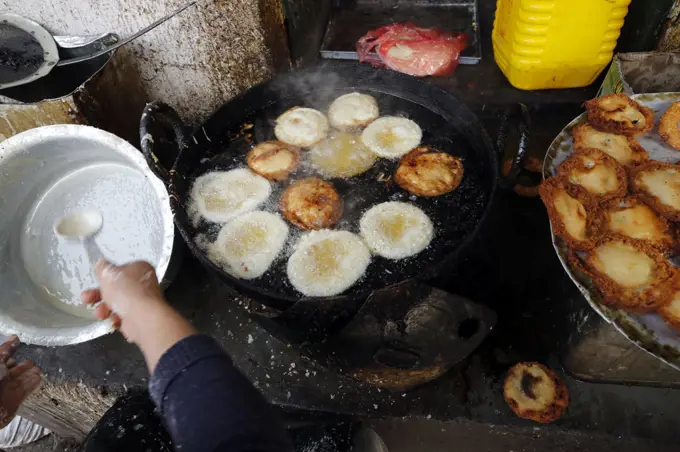 Traditional nepalese restaurant.   Fried Sel Roti, the traditional breakfast for nepali people..